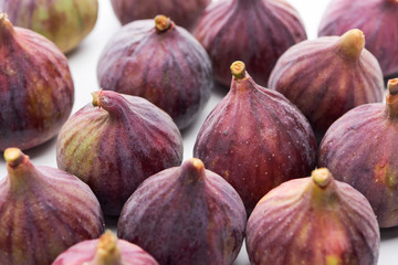 ripe whole delicious figs on white background