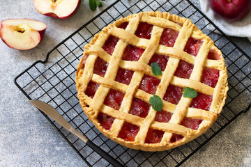 Homemade baking. Autumn apple pie on a light stone or slate table. Free space for your text.