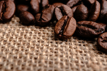 Coffee beans on burlap background