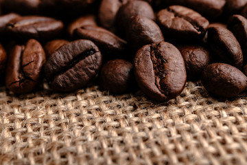 Coffee beans on burlap background