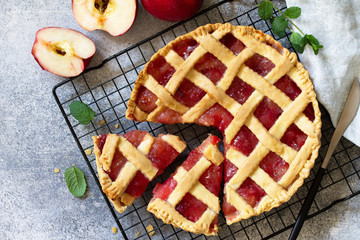 Homemade baking. Autumn apple pie on a light stone or slate table. Top view flat lay. Free space for your text.