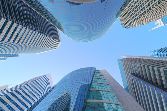 Skyscrapers on blue sky background. in modern or futuristic downtown of the city, Low angle view.