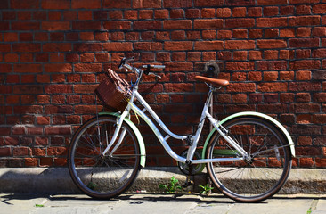 Fototapeta na wymiar Old bicycle leaning on a wall