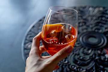 Aperol spritz cocktail on forged metal table