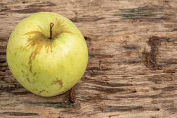 natural and healthy green apple on wooden table