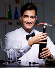 Professional sommelier tasting wine in restaurant