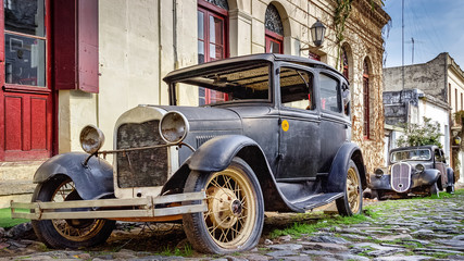 Abandoned Vintage Cars Parked on Streets of Old Town Colonia del Sacramento, Uruguay, UNESCO World...