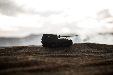War Concept. Military silhouettes fighting scene on war fog sky background, World War German Tanks...