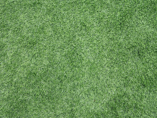 Top view of green artificial grass texture background