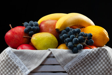 Still life of fruit apple pear grape.