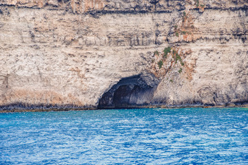 Panorama beach Blue Lagoon Comino Malta. Rocky coast with window and arch Mediterranean Sea