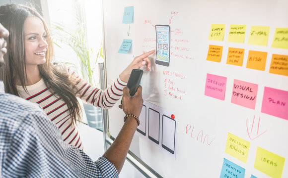 Designers drawing website ux app development.