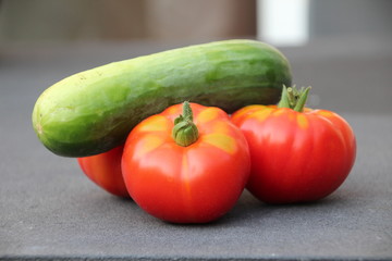 Red tomato with little green after harvesting them from kitchen garden in the Netherlands