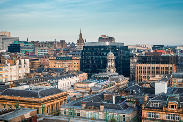 A rooftop view of the mixed architecture of old and new buildings in Glasgow city in late afternoon...