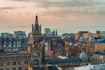 A high angle view of old and new buildings at sunset in Glasgow city centre, Scotland
