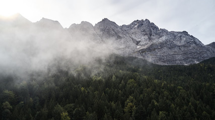 Aerial flight over German Zugspitze with cloudsGerman Zugspitze with clouds in fall