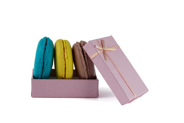 Macaroons box top view. Sweet french macaroons cake on the white background.