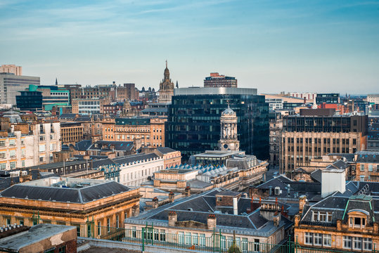 A rooftop view of the mixed architecture of old and new buildings in Glasgow city in late afternoon light, Scotland