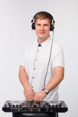  DJ plays in headphones on a white background