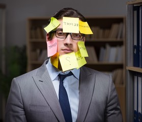 Businessman struggling with conflicting priorities during long h