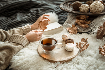 Autumn still life girl holding a Cup of tea.