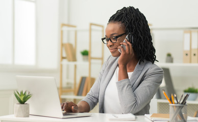 Black Entrepreneur Girl Talking On Cellphone In Office