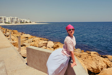 Woman on the spit on the background of the Arab beach - Tunisia, Sousse, El Kantaoui 06 19 2019