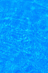 The background of the water in the pool is blue, azure texture
