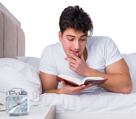 Man in bed suffering from insomnia