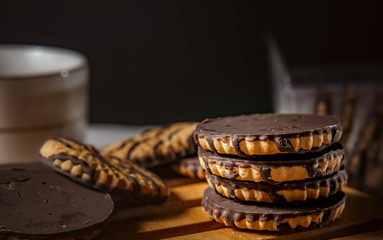 Chocolate cookies on wooden table. Closeup Shortbread cookies chocolate for morning breakfast.