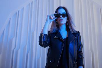 Beautiful girl dancing in retro wave on the neon light