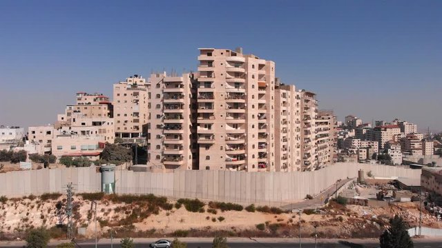 East Jerusalem Palestinian Refugge camp Surrounded By security Concerete Wall Drone Footage of Palestinian Refugge camp Shuafat With Security fence and Army Watch Tower