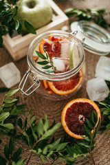 drink in a jar with red orange and ice