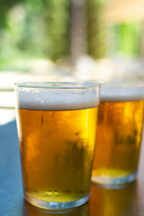 Cold amber color light spanish beer served in glass in outdoor cafe in sunny Andalusia, Spain