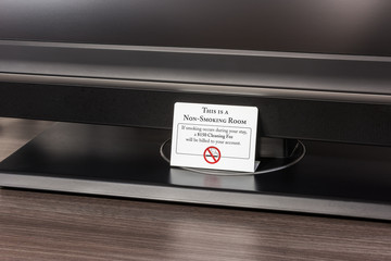 Non-Smoking Warning Tag in Hotel Room, saying a 150 USD cleaning fee will be billed to one's account when smoking occurs