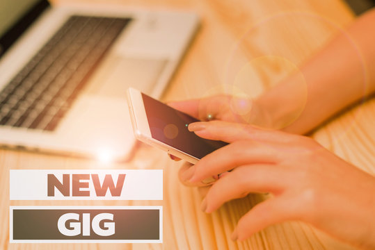 Handwriting text writing New Gig. Conceptual photo getting job Attending live Concert Gigabyte Freelancer offer woman laptop computer smartphone mug office supplies technological devices - Powered by Adobe