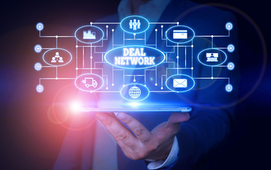 Conceptual hand writing showing Deal Network. Concept meaning platform for secure document sharing and collaboration Male wear formal suit presenting presentation smart device