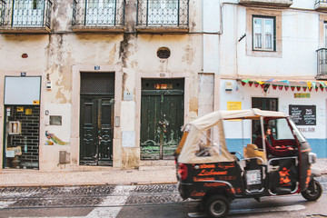 Fototapeta na wymiar Lisbon in Portugal, Street perspective view with colorful traditional houses