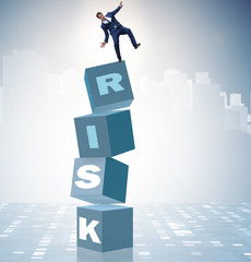 Businessman in risk and reward business concept