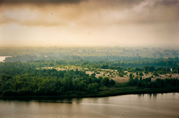 Fototapeta premium vintage foto of sunset over river