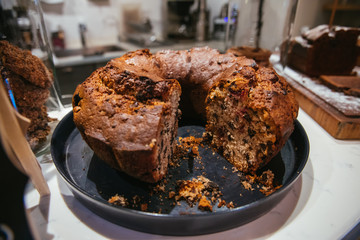 Christmas chocolate or fruit cake on the table. Winter cake in cafe cake shop or coffee shop.