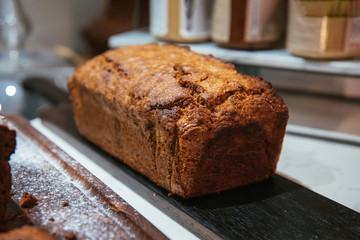 Christmas chocolate or fruit cake on the table. Winter cake in cafe cake shop or coffee shop.
