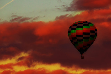 hot air balloon in the sun set colors