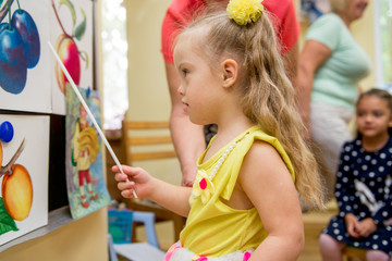 Girl with Down Syndrome develops thinking in a rehabilitation center for special children