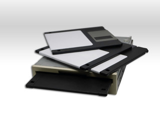 Floppy disk insert to floppy drive isolated on white background with clipping path