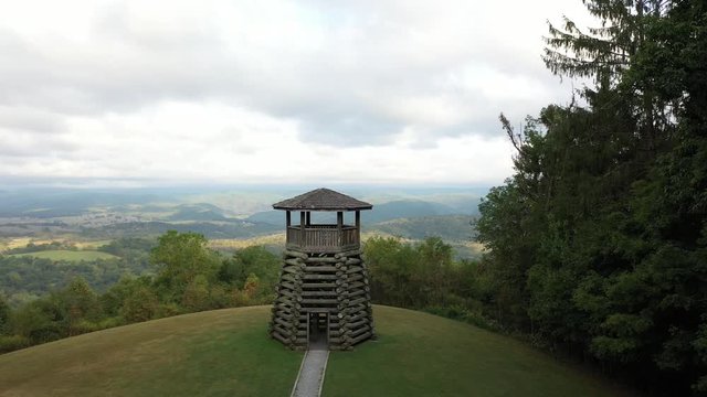 Aerial orbit low and to the left showing the overlook tower at Droop Mountain State Park in West Virginia.