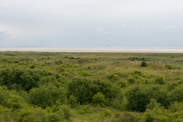Sea ​​view from Schiermonnikoog with rigs in the sea