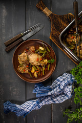 Prepared for baking chicken meat with vegetables.