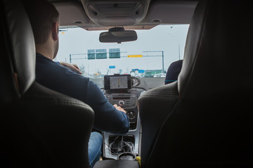 Driver in the car controls the navigator.