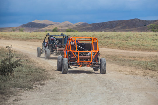 Buggy moves on a dirt dusty road